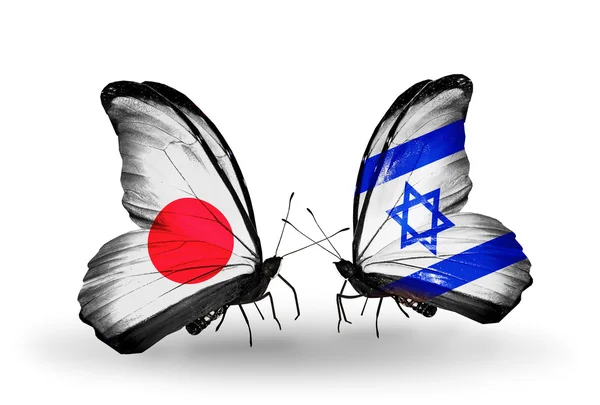 Dwa motyle z flagami na skrzydłach jako symbol stosunków japonia i Polska — Zdjęcie stockowe