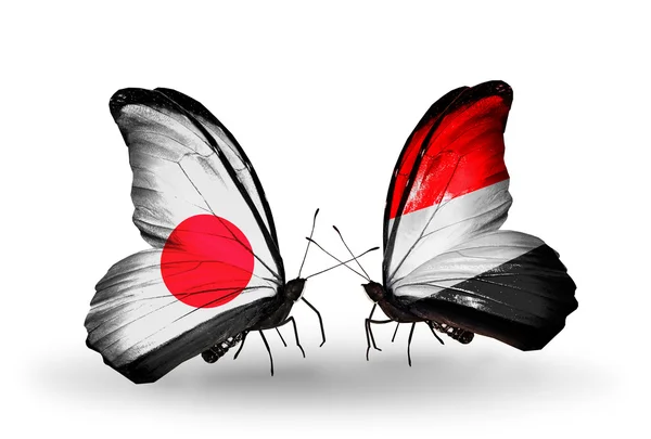 Two butterflies with flags on wings as symbol of relations Japan and Yemen — Stock Photo, Image