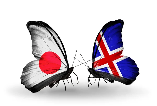 Dos mariposas con banderas en alas como símbolo de relaciones Japón e Islandia —  Fotos de Stock