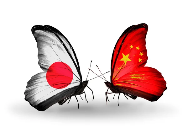 Two butterflies with flags on wings as symbol of relations Japan and China — Stock Photo, Image