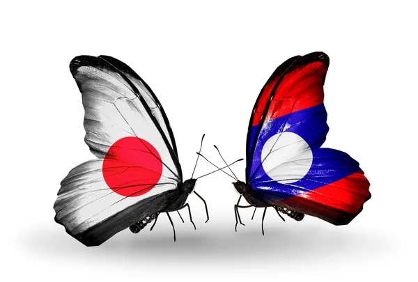 Dos mariposas con banderas en alas como símbolo de relaciones Japón y Laos —  Fotos de Stock