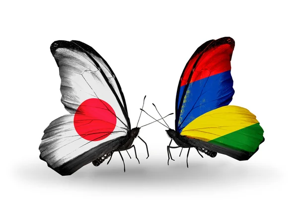 Two butterflies with flags on wings as symbol of relations Japan and Mauritius — Stock Photo, Image