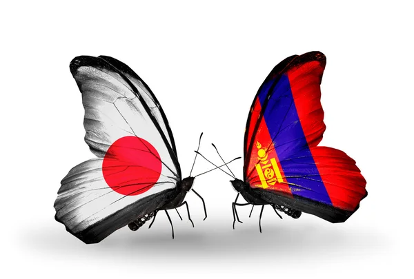 Twee vlinders met vlaggen op vleugels als symbool van betrekkingen japan en Mongolië — Stockfoto