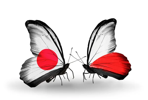 Dos mariposas con banderas en alas como símbolo de relaciones Japón y Polonia — Foto de Stock