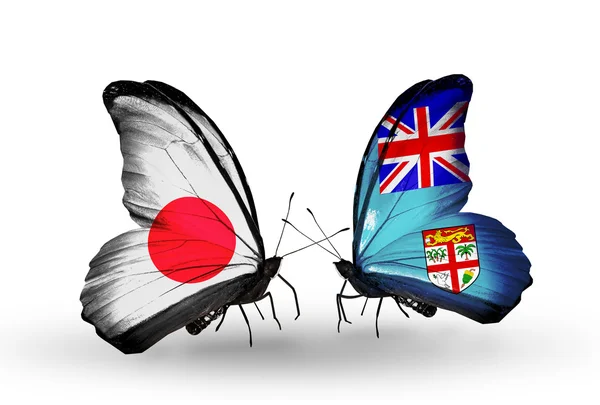 Due farfalle con bandiere sulle ali come simbolo delle relazioni Giappone e Figi — Foto Stock
