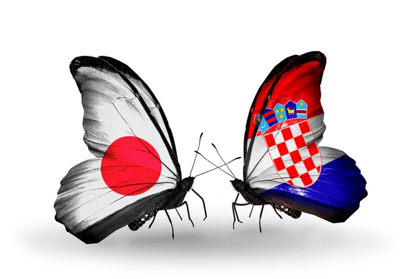 Dwa motyle z flagami na skrzydłach jako symbol Japonii stosunków i Chorwacja — Zdjęcie stockowe