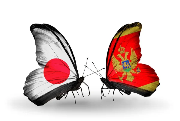 Deux papillons avec des drapeaux sur les ailes comme symbole des relations Japon-Monténégro — Photo