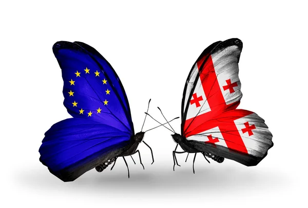 Two butterflies with flags on wings as symbol of relations EU and Georgia — ストック写真