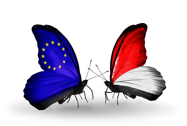 Two butterflies with flags on wings as symbol of relations EU and Monaco, Indonesia — Stock Photo, Image