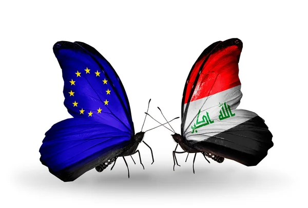 Twee vlinders met vlaggen op vleugels als symbool van betrekkingen eu en Irak — Stockfoto