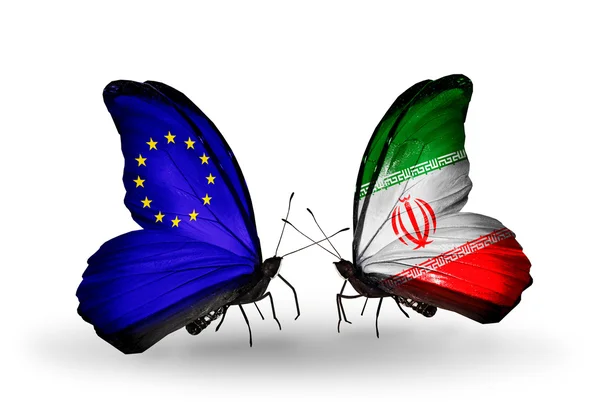 Две бабочки с флагами на крыльях как символ отношений ЕС и Ирана — стоковое фото