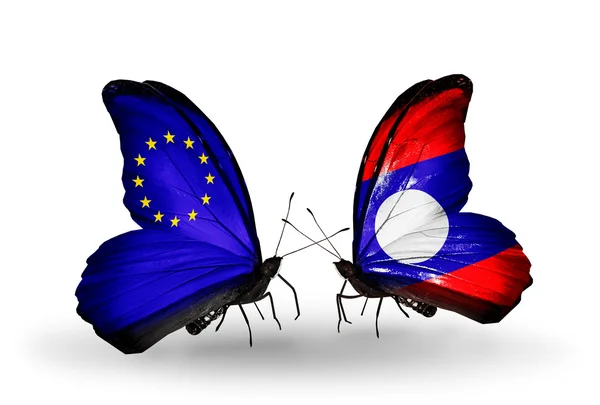 Dwa motyle z flagami na skrzydłach jako symbol stosunków UE i laos — Zdjęcie stockowe