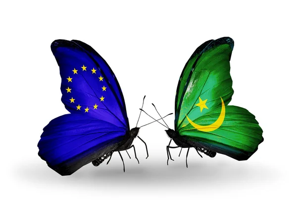 Dwa motyle z flagami na skrzydłach jako symbol stosunków UE i Mauretania — Zdjęcie stockowe