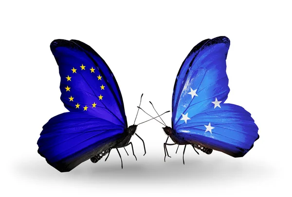 Two butterflies with flags on wings as symbol of relations EU and Micronesia — Stock Photo, Image