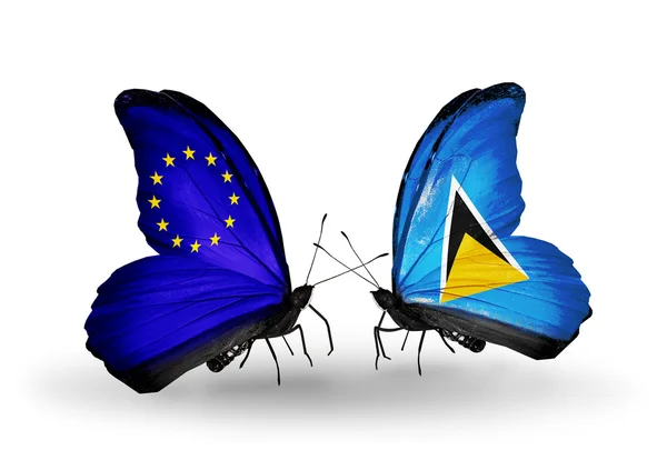 两只蝴蝶带有标志的象征关系欧盟和圣卢西亚的翅膀 — 图库照片