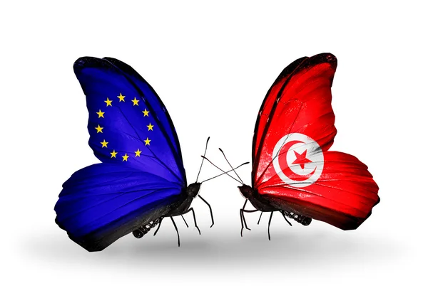 Dwa motyle z flagami na skrzydłach jako symbol stosunków UE i Tunezja — Zdjęcie stockowe