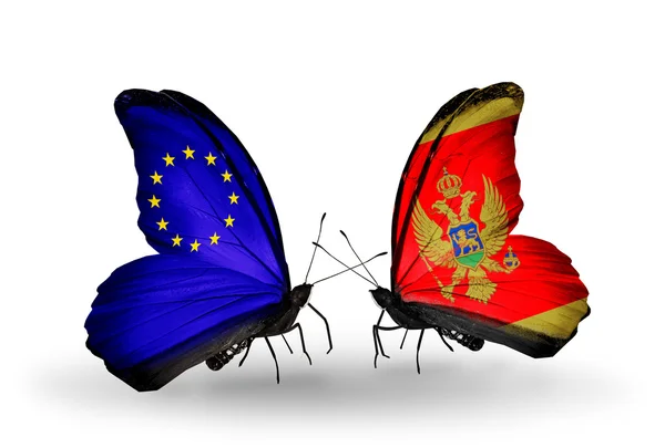 Duas borboletas com bandeiras nas asas como símbolo das relações UE e Montenegro — Fotografia de Stock