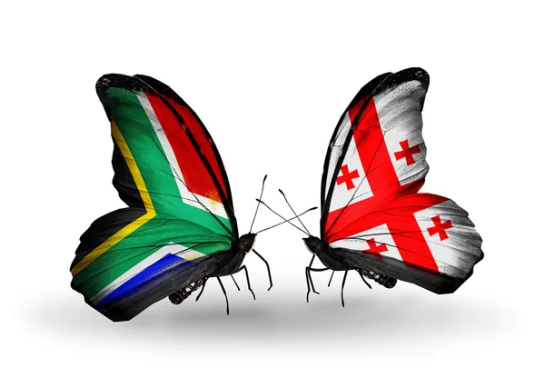 Two butterflies with flags on wings as symbol of relations South Africa and Georgia — Stock Photo, Image