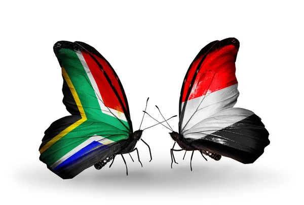 Dwa motyle z flagami na skrzydłach jako symbol stosunków, RPA i Jemenu — Zdjęcie stockowe