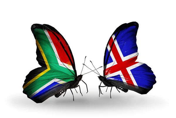 Dva motýli s příznaky na křídlech jako symbol vztahů, Jižní Afrika a Island — Stock fotografie