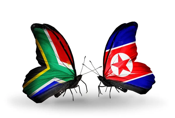 Two butterflies with flags on wings as symbol of relations South Africa and North Korea — Stock Photo, Image