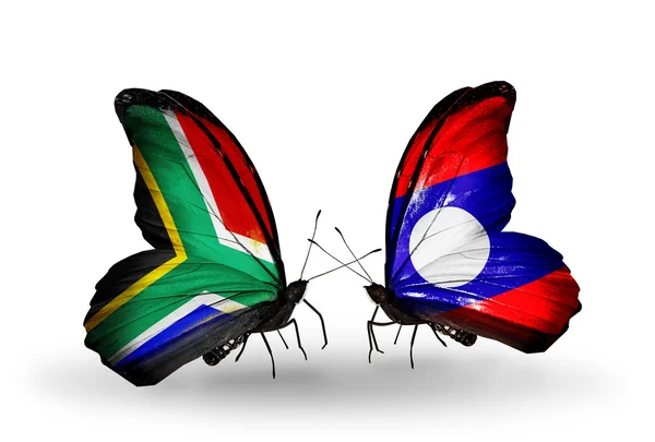 Dos mariposas con banderas en alas como símbolo de las relaciones Sudáfrica y Laos — Foto de Stock