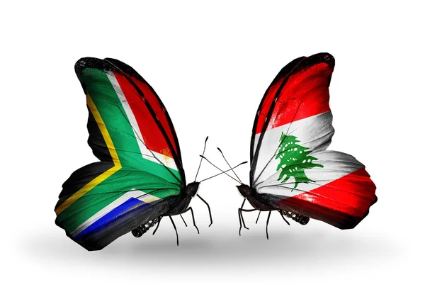 Two butterflies with flags on wings as symbol of relations South Africa and Lebanon — Stock Photo, Image