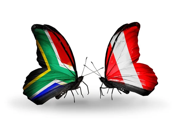 Két pillangók szárnyain zászlókkal kapcsolatok jelképe Dél-Afrika és peru — Stock Fotó