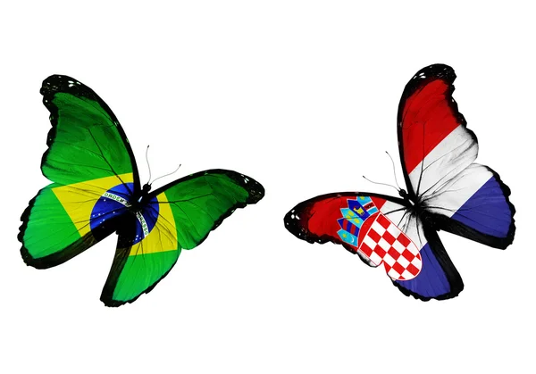 Concept - two butterflies with Brazil and Croatian flags flying, like two football teams playing — Stock Photo, Image