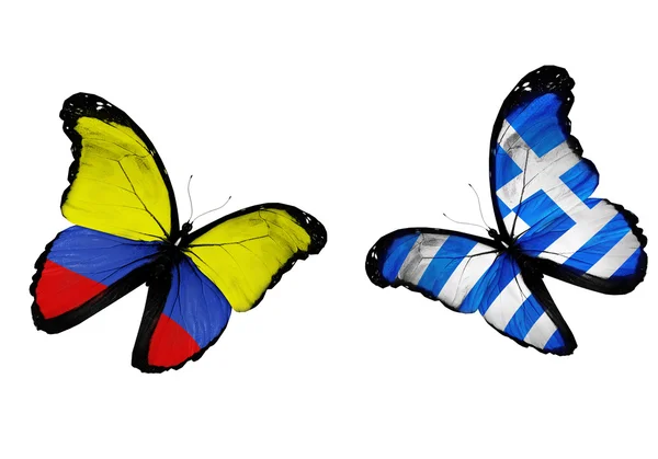 Concept - two butterflies with Columbia and Greece flags flying, like two football teams playing — Stock Photo, Image