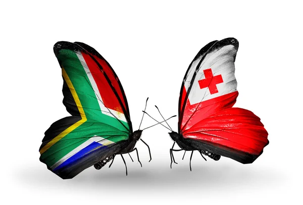 Two butterflies with flags on wings as symbol of relations South Africa and Tonga — Stock Photo, Image