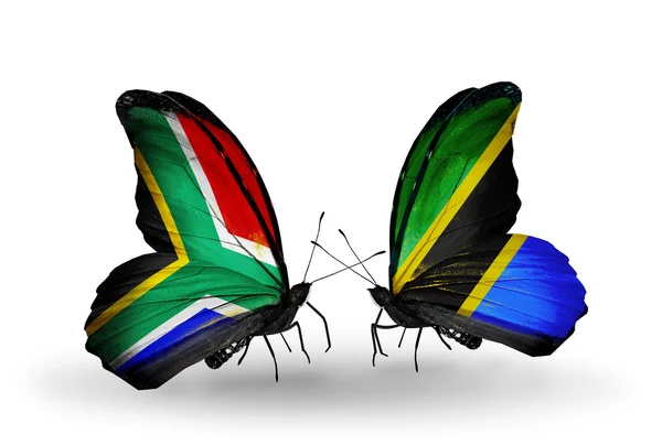 Two butterflies with flags on wings as symbol of relations South Africa and Tanzania — Stock Photo, Image