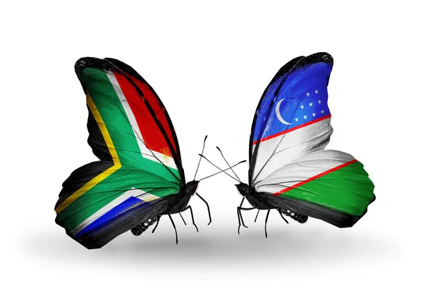 Two butterflies with flags on wings as symbol of relations South Africa and Uzbekistan — Stock Photo, Image