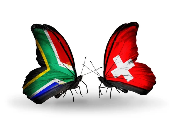 Zwei Schmetterlinge mit Flügelfahnen als Symbol der Beziehungen zwischen Südafrika und der Schweiz — Stockfoto