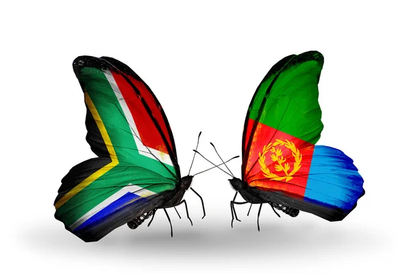 Twee vlinders met vlaggen op vleugels als symbool van de betrekkingen, Zuid-Afrika en eritrea — Stockfoto