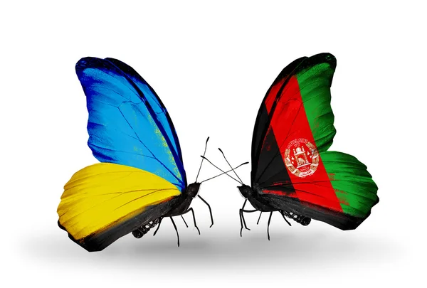 Duas borboletas com bandeiras nas asas como símbolo das relações Ucrânia e Afeganistão — Fotografia de Stock