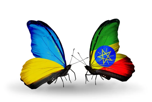 Two butterflies with flags on wings as symbol of relations Ukraine and Ethiopia — Stock Photo, Image