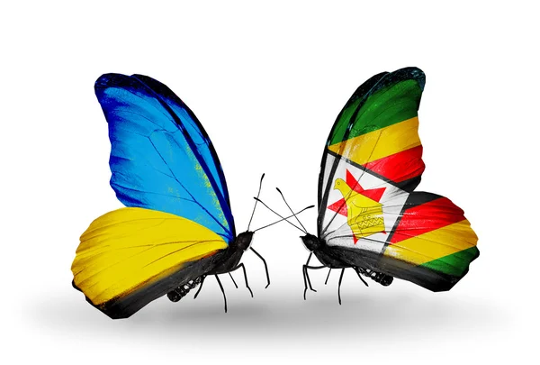 Dos mariposas con banderas en las alas como símbolo de las relaciones Ucrania y Zimbabwe —  Fotos de Stock