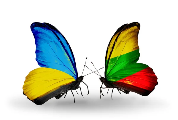 Two butterflies with flags on wings as symbol of relations Ukraine and Lithuania — Stock Photo, Image