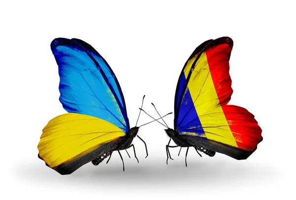 Duas borboletas com bandeiras nas asas como símbolo das relações Ucrânia e Chade, Roménia — Fotografia de Stock