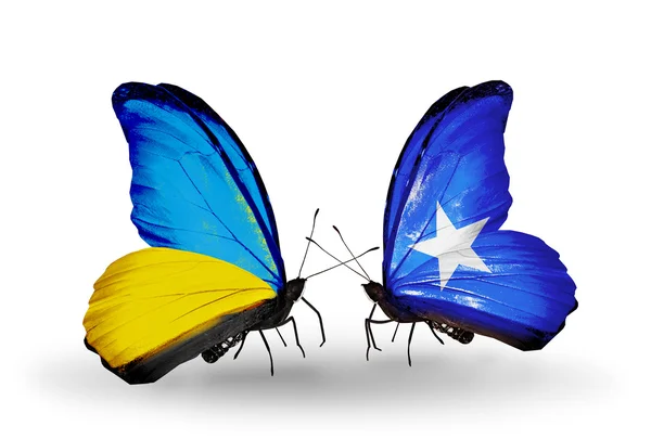 Two butterflies with flags on wings as symbol of relations Ukraine and Somalia — Stock Photo, Image