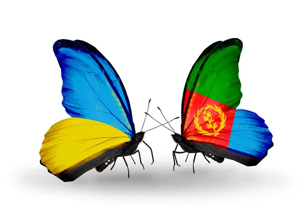 Due farfalle con bandiere sulle ali come simbolo delle relazioni Ucraina ed Eritrea — Foto Stock