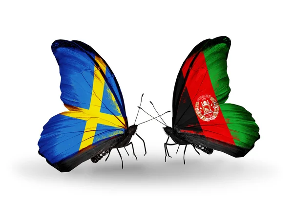 Two butterflies with flags on wings as symbol of relations Sweden and Afghanistan — Stock Photo, Image