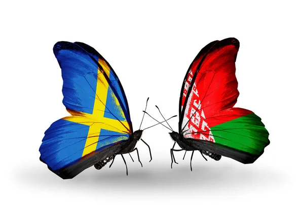 Two butterflies with flags on wings as symbol of relations Sweden and Belarus — Stock Photo, Image