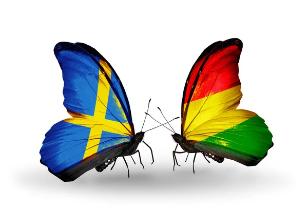 Two butterflies with flags on wings as symbol of relations Sweden and Benin — Stock Photo, Image