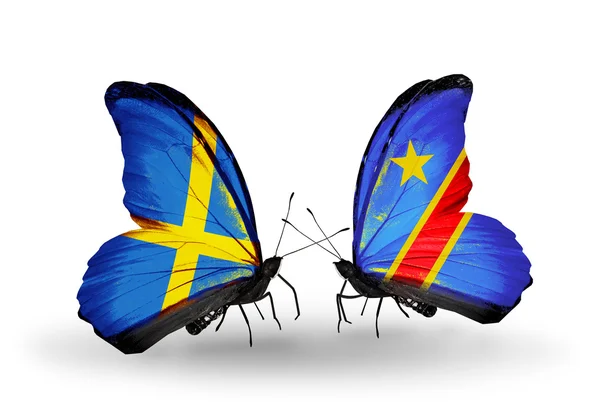 Two butterflies with flags on wings as symbol of relations Sweden and Kongo — Stock Photo, Image