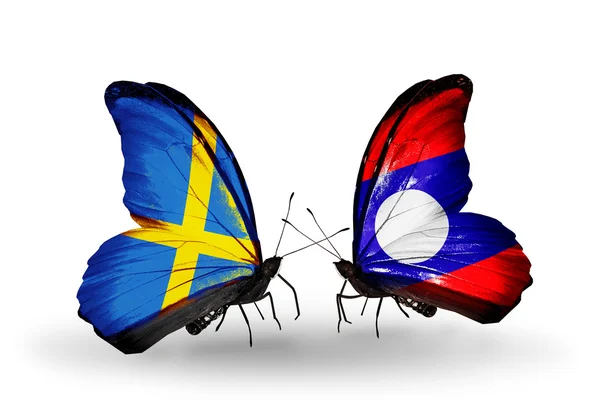 Two butterflies with flags on wings as symbol of relations Sweden and Laos — Stock Photo, Image