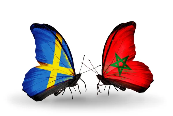 Dos mariposas con banderas en alas como símbolo de relaciones Suecia y Marruecos — Foto de Stock
