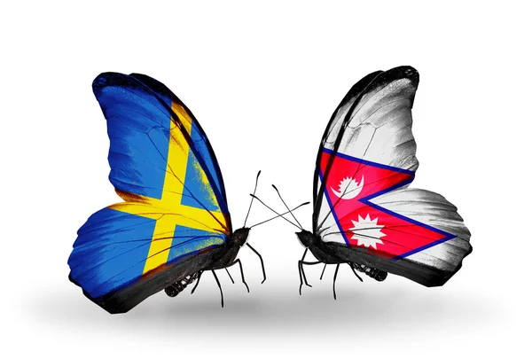 2 つの蝶の翼上のフラグとの関係の記号としてスウェーデンとネパール — ストック写真