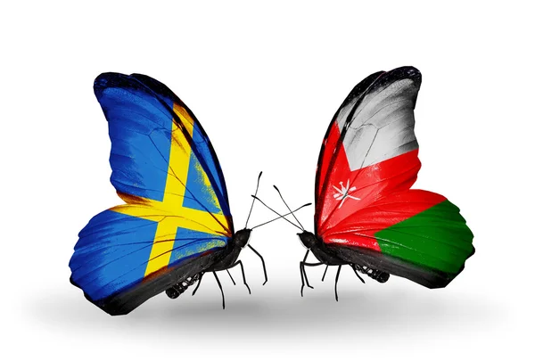 2 つの蝶の翼上のフラグと関係の象徴としてスウェーデンそしてオマーン — Stock fotografie